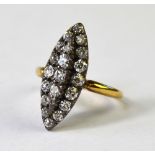 An antique old cut diamond set marquise shaped cluster ring with open backed setting,