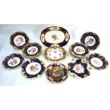 A Coalport blue ground tureen stand, or other dish, decorated with floral designs, 33 cm diameter,