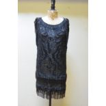 A 1920s profusely sequinned and jet-beaded flapper dress,