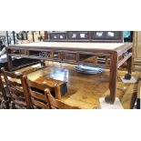 A Chinese rattan panelled hardwood low table having a raised gallery back over two frieze drawers,