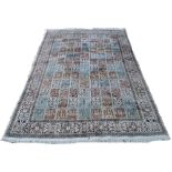 A Persian silk Qom rug, the field of dif
