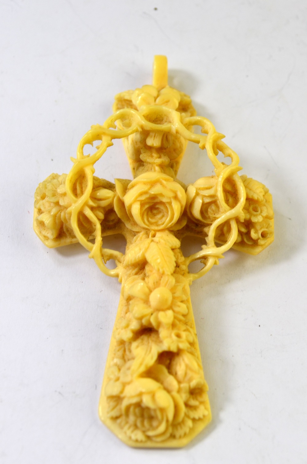 A Victorian ornate carved ivory cross of