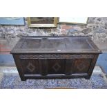 A 17th/18th century oak coffer, the trip