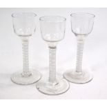 A set of three late 18th/early 19th century cordial glasses, ogee bowl, multiple opaque twist stem,