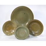 A large celadon dish with a crackle design and unglazed base,