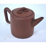 A Yixing teapot and cover with loose-ring handle finial; of cylindrical form,