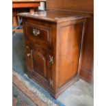A good quality oak pot cupboard with panelled door (probably Brights of Nettlebed)
