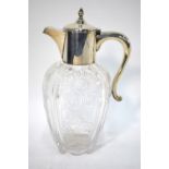 A fine quality Edwardian glass claret jug with wheel-cut floral and foliate design,