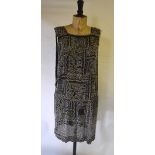 A 1920s black chiffon tabard profusely sewn with pearlised beads and gold metalised thread,
