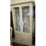 An Italian cream painted two door display cabinet to match Lot 1263