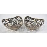 A pair of silver bonbon dishes of dished trefoil form, pierced with butterflies,