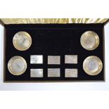 A cased part set of four engine-turned sterling ashtrays and six matchbox covers,