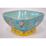 A famille rose bowl decorated with floral and Lepidoptera designs; turquoise blue interior; 20.