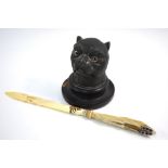 A cast metal bulldog's head inkwell with glass eyes,