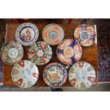 A set of four dishes decorated with bold,