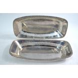 A pair of pierced oblong bread-dishes with scale-moulded rims, Barker Brothers Silver Ltd.