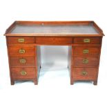 A 19th century mahogany campaign desk in original condition retaining the original detachable,