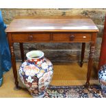 A Victorian mahogany side/writing table having a pair of frieze drawers,