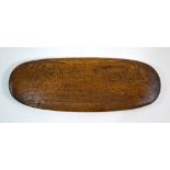 An Easter Island oval wood story plaque decorated with rongorongo script. 23.