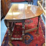 An 18th century style walnut gateleg table,