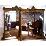 A companion pair of mid 19th century giltwood and composite framed over-mantel mirrors,