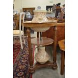 A continental walnut 3-tier washstand c/w a Victorian floral-printed pottery wash ewer,