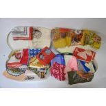 Two oval white cases containing a large collection of vintage scarves,