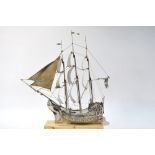 A late Victorian silver three-masted galleon, in full sail,