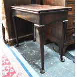 An 18th century Cuban mahogany tea table, the rectangular fold over top over a plain frieze,