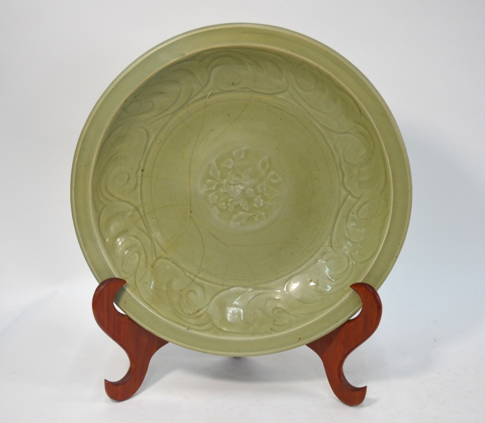 A Ming celadon dish of circular form, decorated at the centre with a floral spray, - Image 2 of 6