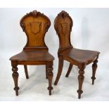 A pair of Victorian oak shield back hall chairs (2)