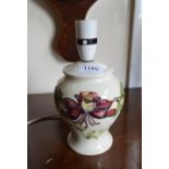 A Moorcroft cream-ground table lamp with floral decoration 15 cm high