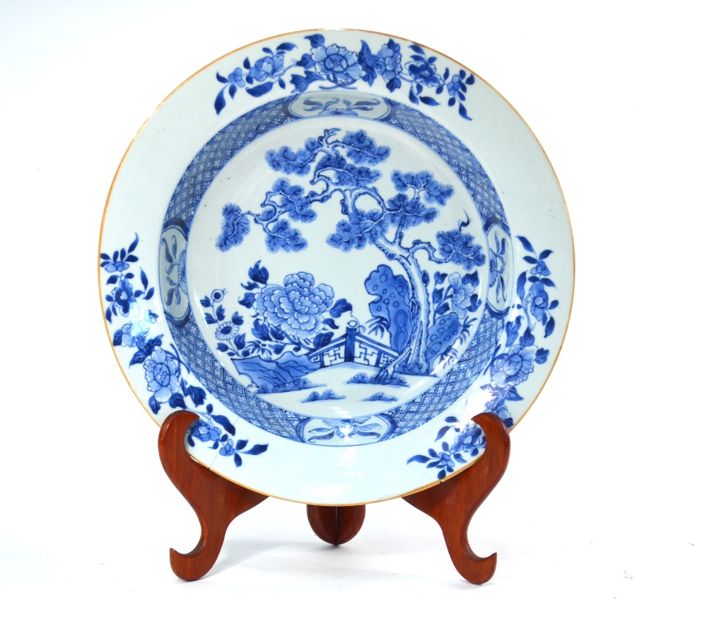 A blue and white, Chinese Export, circular basin, decorated with floral designs of pine and peony,