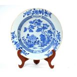 A blue and white, Chinese Export, circular basin, decorated with floral designs of pine and peony,