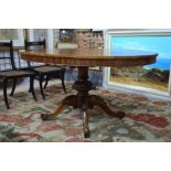 A Victorian rosewood breakfast table with oval tilt-top,
