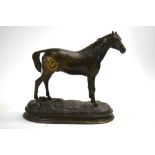 A bronze figure of a stallion,