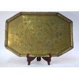 A North African, or other metalwork, tray of octagonal form decorated with a reticulated rim,
