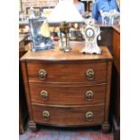 A 19th century mahogany bowfront chest of three long graduated drawers flanked by burr-oak veneered