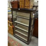 A French ebonised vitrine cabinet with brass stringing and mounts,