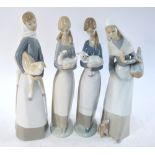 Three Lladro figures of girls carrying farm animals/birds, to/w a lady with a dog, 17 cm - 18.