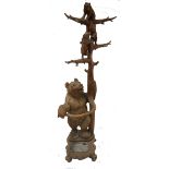 A late 19th century Swiss Black Forest carved bear hall stand,
