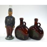 A 19th century wine bottle moulded in the form of a French soldier, enamelled red and blue uniform,