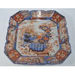 An elegant Japanese Imari dish of square form with a foliate rim; decorated in underglaze blue,