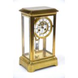 A 19th century lacquered brass four glass mantel clock,