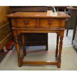 A Brights of Nettlebed oak small side table with frieze drawer