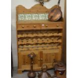 A waxed pine kitchen cabinet, incorporating drawers,