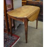 A 19th century continental chestnut dropleaf circular kitchen table with end drawer,