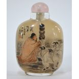 An inside-painted Chinese snuff bottle, decorated with a Scholar, seated beside three goats,
