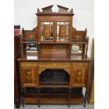 An Edwardian inlaid rosewood display sideboard with mirrored upper doors,