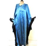 A Chinese gentleman's blue silk satin robe edged with black satin, with peach lining,